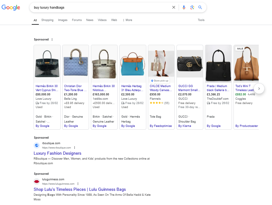 Google search results page showing the paid ad results for the query 'buy luxury handbags'